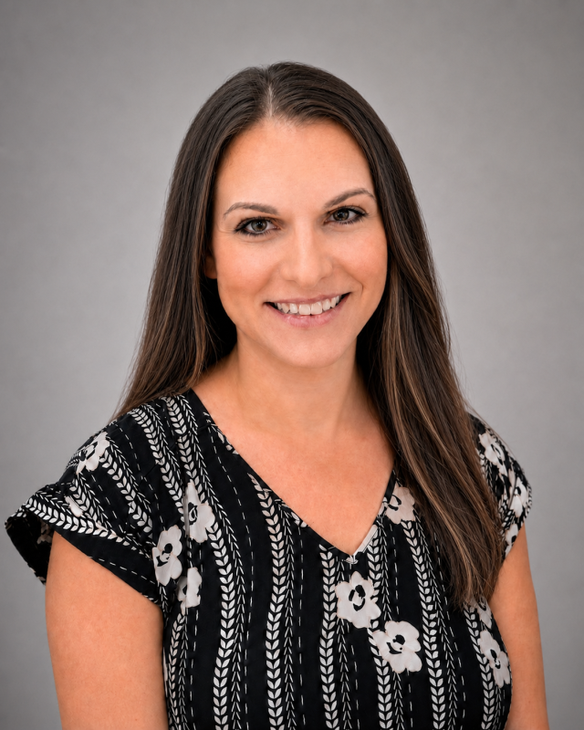 Portrait of Erica, dental staff member smiling in professional attire